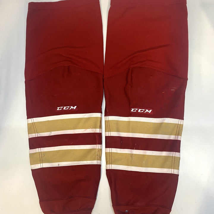 NCAA - Chaussettes de hockey CCM d'occasion (rouge/or/blanc)